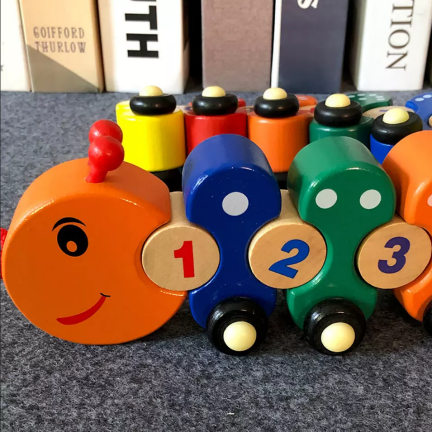 TG67019 Holzzug mit Raupenkette – Lernpuzzle zum Erlernen der Zahlen